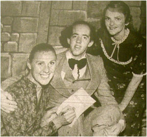 In our picture Michael is seen with two of “Ruddigore’s” leading players, Barbara Colclough and Angela Hopkins.