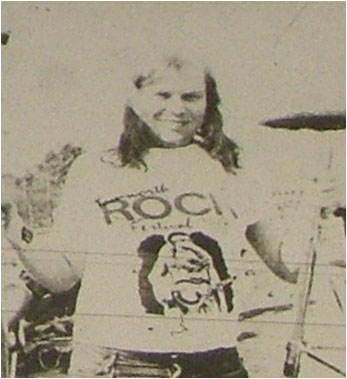 Caption: Mike Fleming resplendent in rock festival T-shirt gets ready for action with Cuddly Spiders.