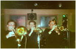 Bash Out The Odd's brass section pictured live on stage in December, 1989 in Nuneaton at a club called Graysons. Left to right: Bryan Hudley (bass trombone), Martin Cooper (trumpet & Eb trumpet), Mark Allison (trumpet, cornet).