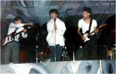 Thirty Frames a Second on stage at St John's Youth Club on the Leys in October 1981 (left to right): Mark Mortimer (bass), Matthew Lees (lead vocals, guitar), Andrew Baines (guitar) and hidden behind, Donald Skinner (drums). Not pictured was Paul Summers (keyboards).